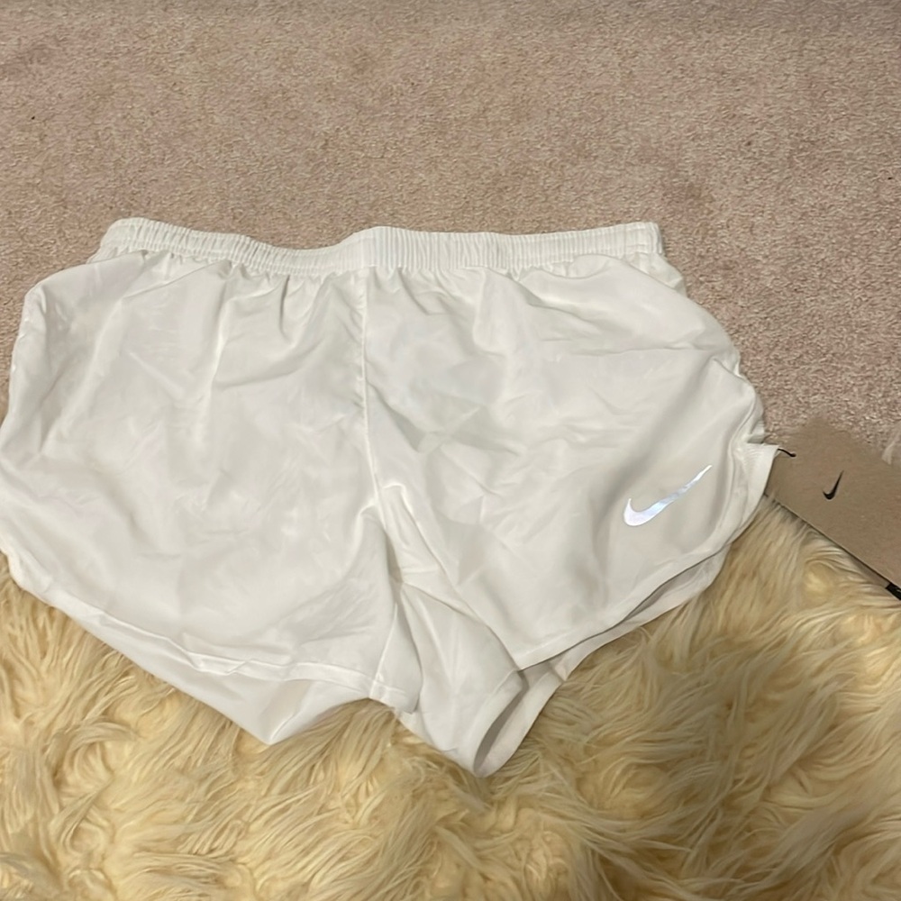 new with tags white nike running shorts!!